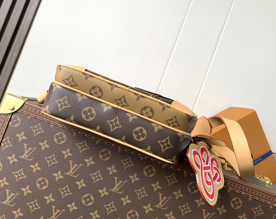 3 Louis Vuitton This Nil messenger bag features a Monogram canvas body accented with Damier and Monogram Reverse canvas patches, creating an elegant patchwork effect.
