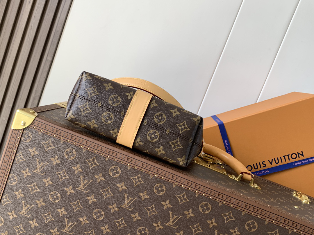 3 Louis Vuitton This Pochette Mia handbag, part of the Monogram collection, features a Monogram canvas body accented with cowhide leather trim.