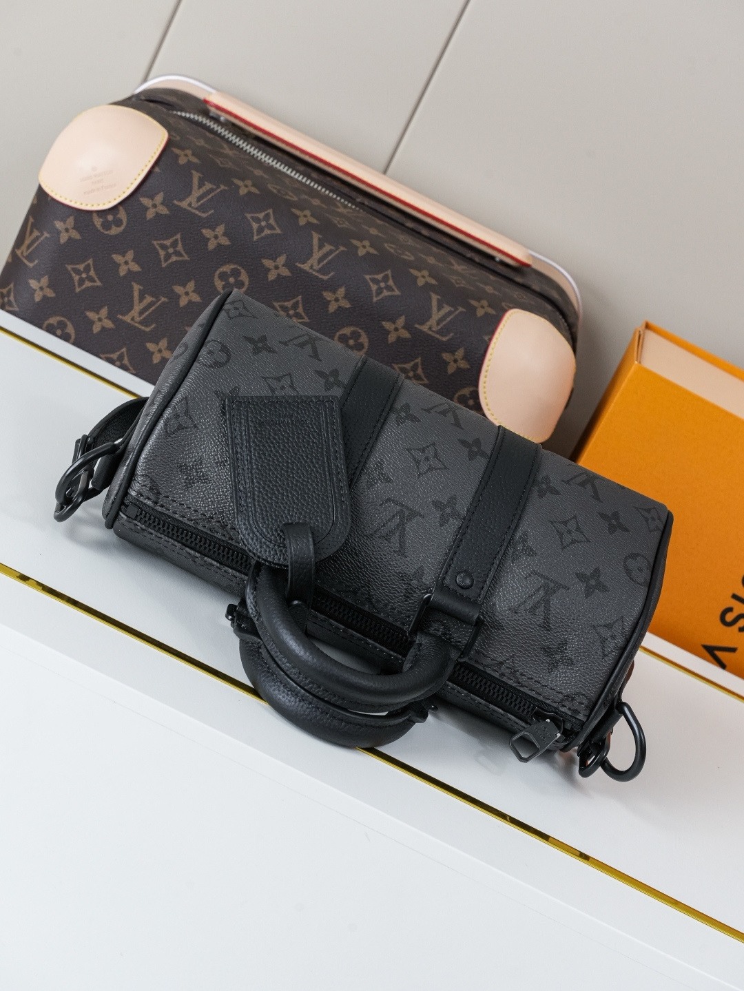 3 Louis Vuitton This Keell Bandoulière 25 handbag features Monogram Midnight coated canvas accented with a deep Monogram print.