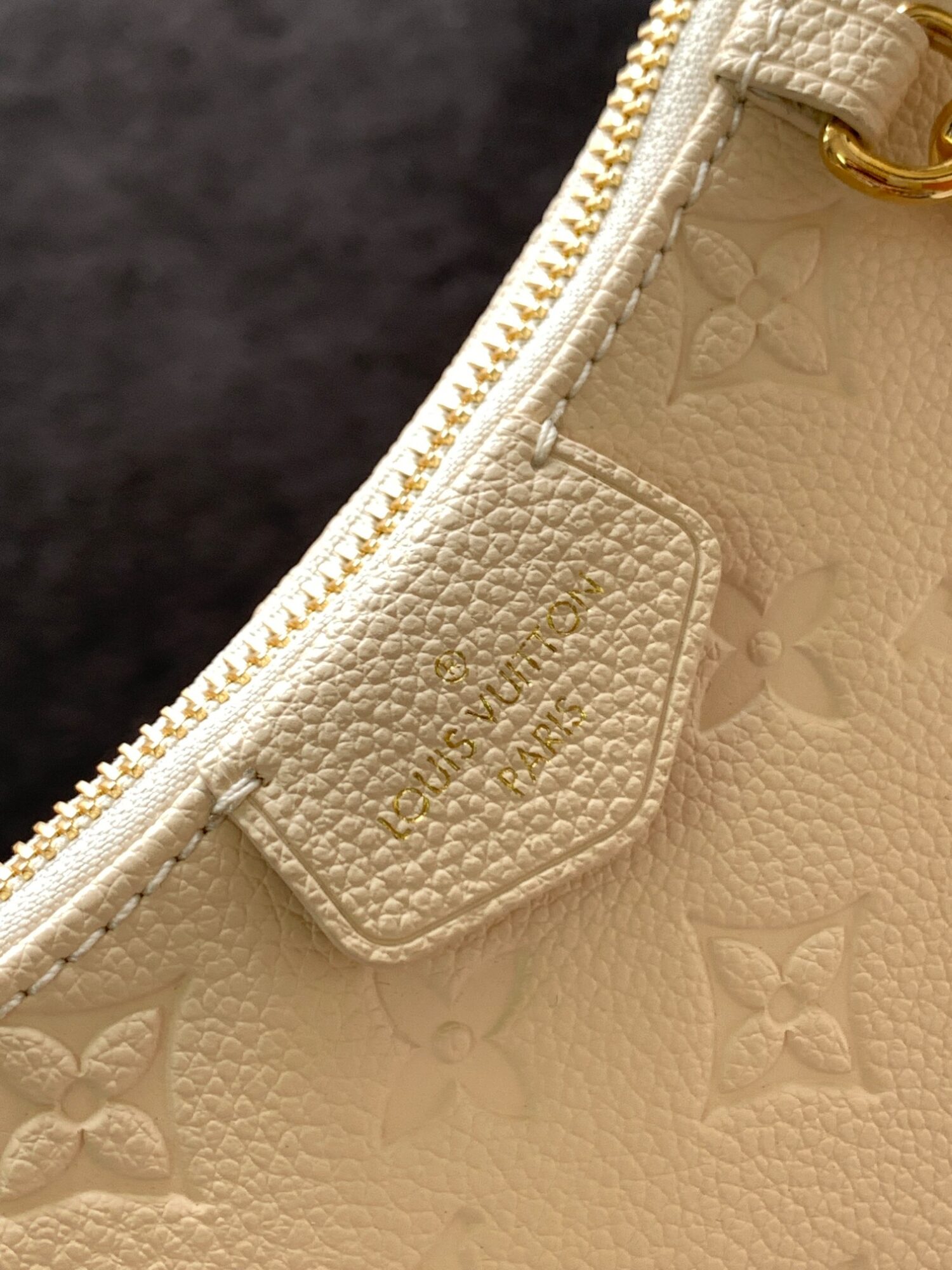 3 Louis Vuitton The Easy Pouch On Strap handbag from the Spring 2022 Collection is crafted from Monogram Empreinte leather.