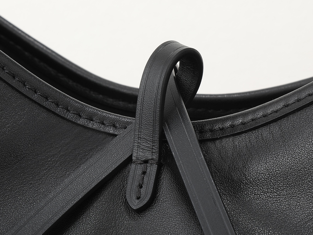 3 Louis Vuitton This small CarryAll Cargo handbag is crafted from soft lambskin, featuring a stylishly micro-crinkled finish.