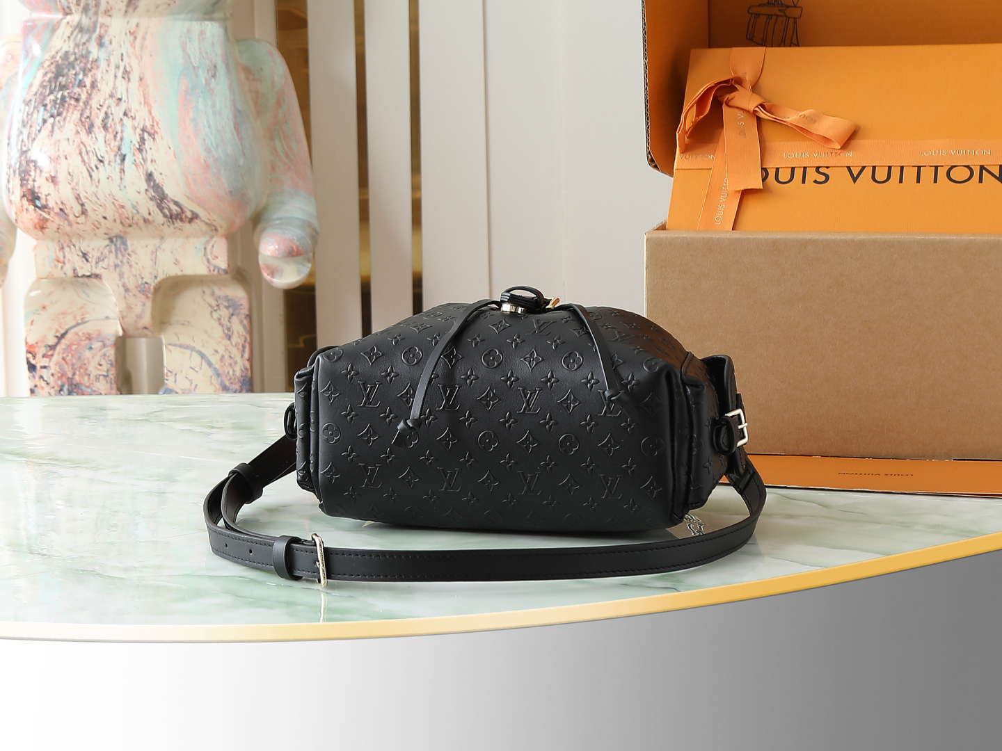 Louis Vuitton The M25554 Odyssée handbag in black full leather, hailing from the Early Autumn 2025 collection, cleverly references the 2024 Cruise collection.