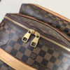 4 Louis Vuitton This Discovery Small Backpack features Monogram canvas accented with Monogram Reverse and Damier canvas patches.