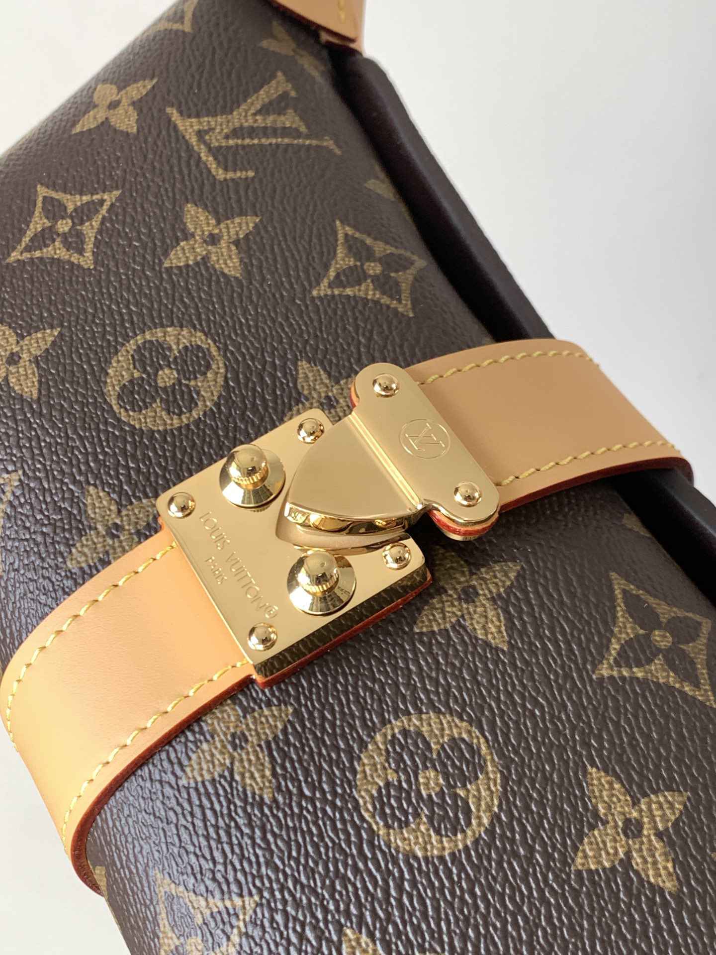 4 Louis Vuitton This Pochette Mia handbag, part of the Monogram collection, features a Monogram canvas body accented with cowhide leather trim.