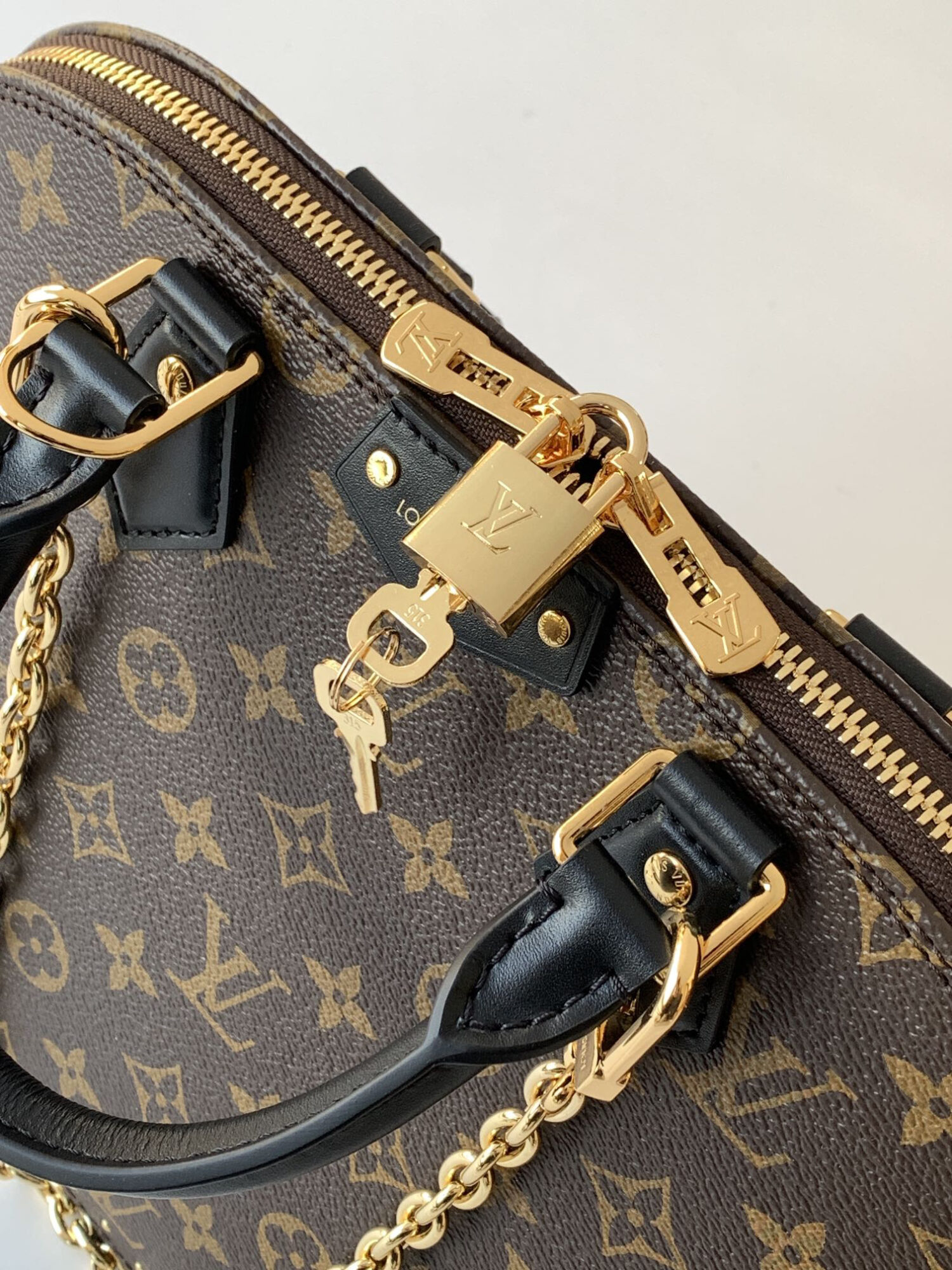 4 Louis Vuitton The Trunk collection welcomes a contemporary new iteration of the Alma Small handbag, paying homage to the brand's travel heritage with exquisite metal hardware.