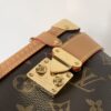 Louis Vuitton This large Side Trunk handbag features Monogram canvas accented with contrasting leather trim.