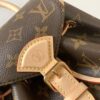4 Louis Vuitton This Montsouris Mini features Monogram coated canvas with cowhide leather trim.