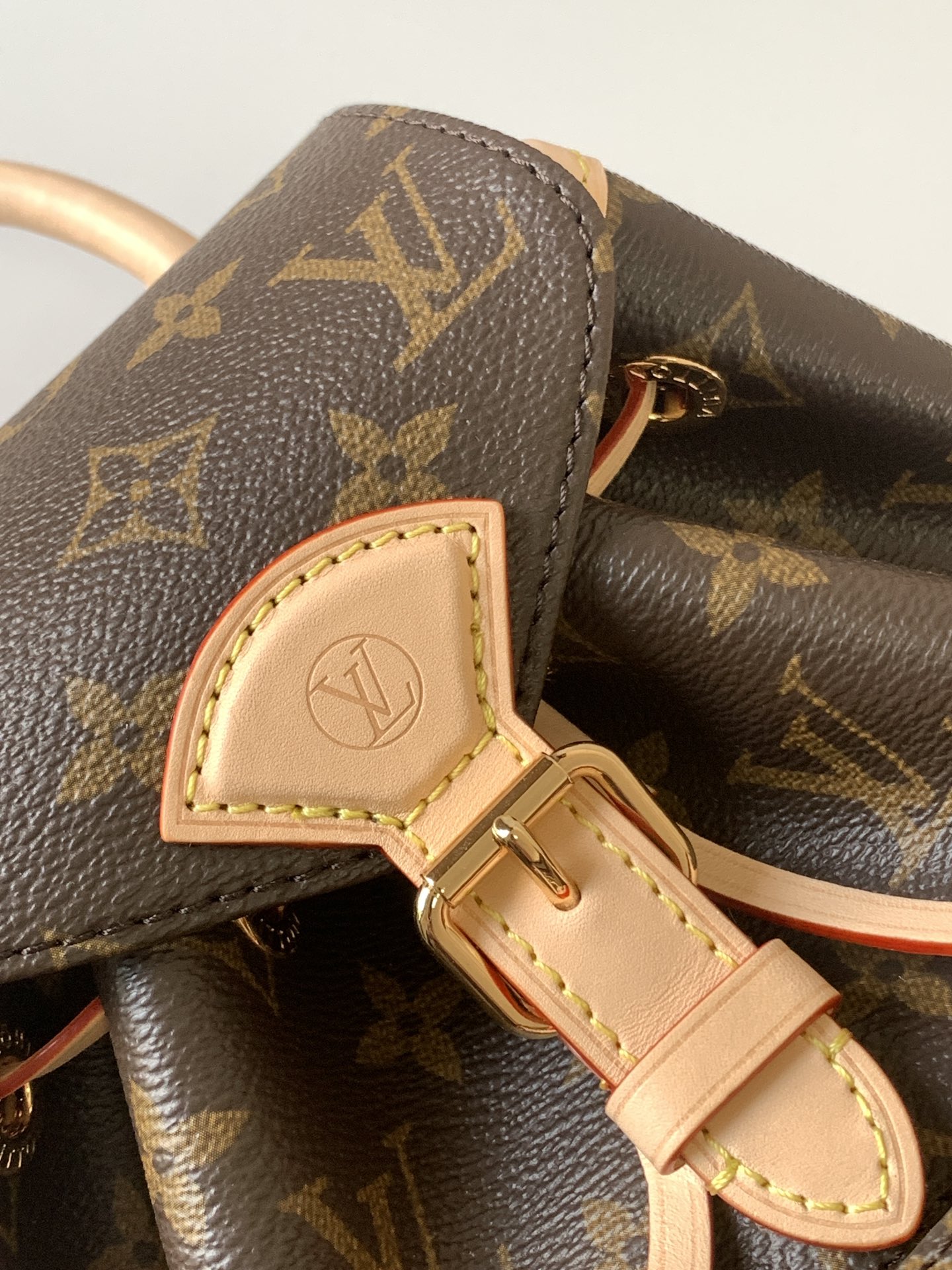 4 Louis Vuitton This Montsouris Mini features Monogram coated canvas with cowhide leather trim.