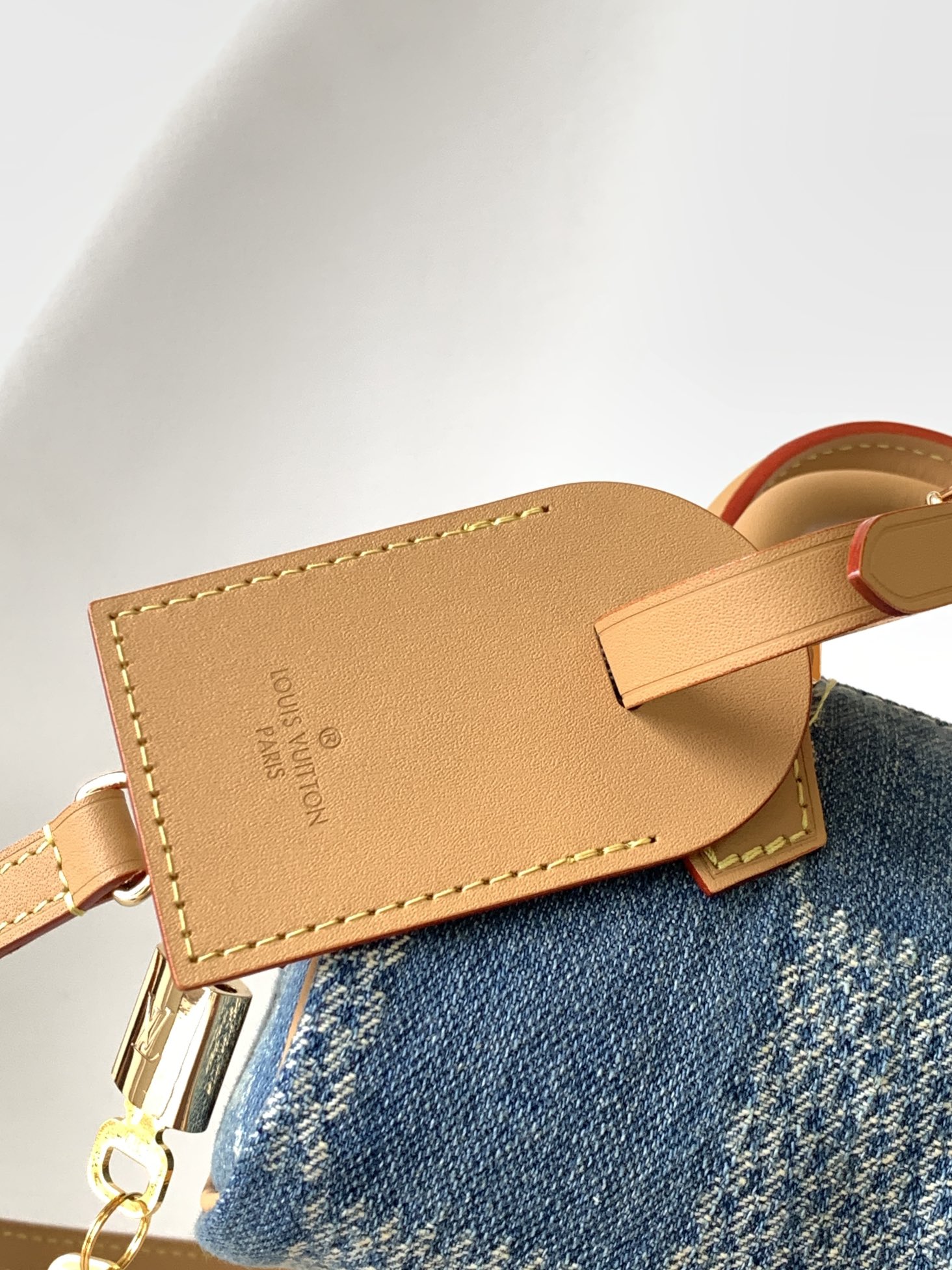 4 Louis Vuitton N40682 — FW New Denim Collection. The Sunset bag takes center stage in Monogram Denim canvas.