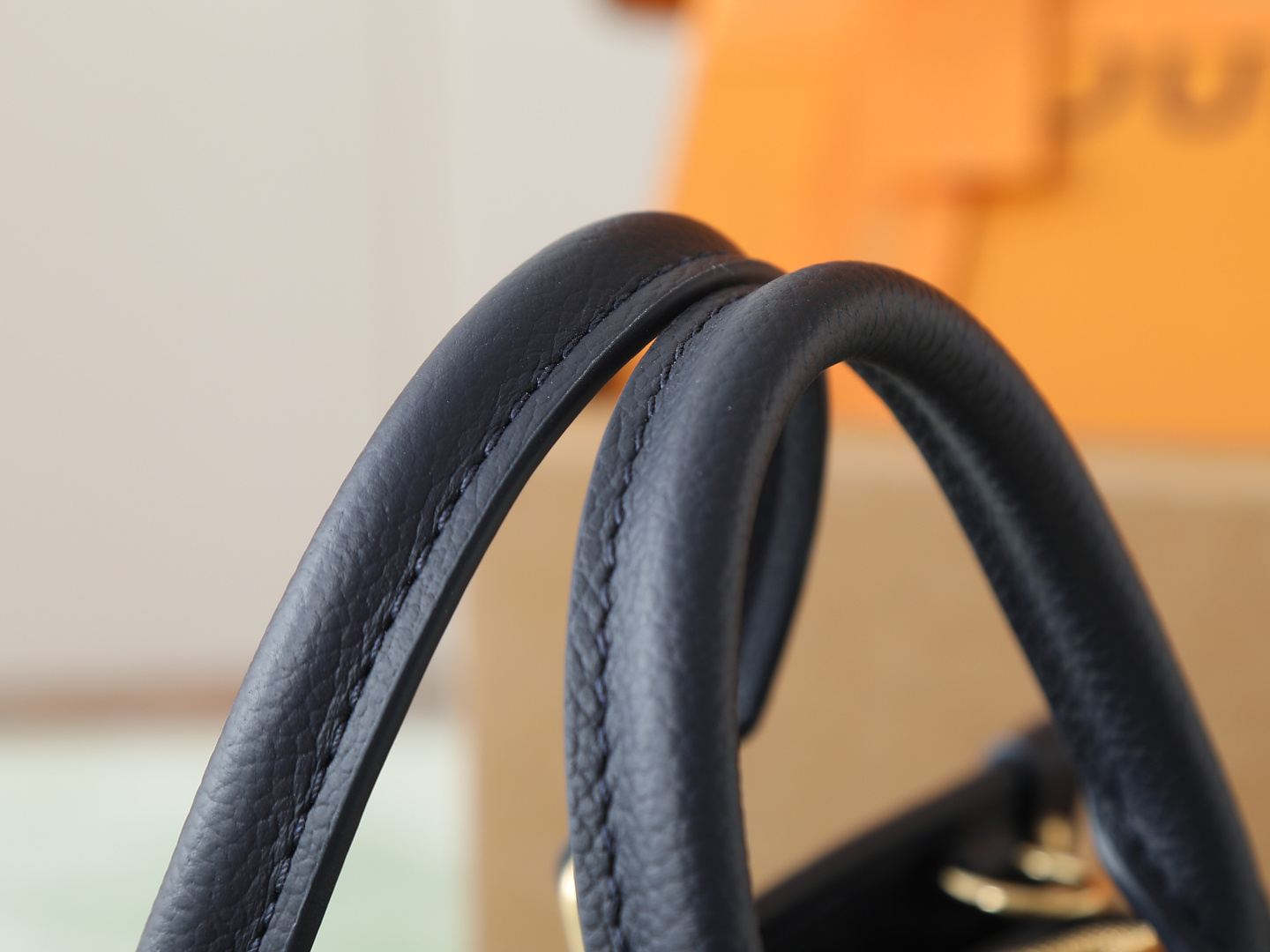 4 Louis Vuitton M23640 Deep Blue Embossed: This small OnTheGo handbag is crafted from Monogram Empreinte leather, embossed with the Giant Monogram pattern.