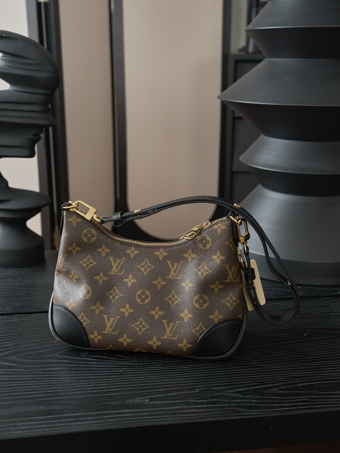 Louis Vuitton Crafted from classic Monogram canvas, this small Boulogne handbag features a double-zip closure and a spacious interior flat pocket large enough to accommodate a smartphone.
