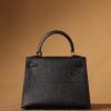 5 Hermes Kelly bag, black, 25cm, with gold hardware.