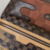 5 Louis Vuitton This Discovery Small Backpack features Monogram canvas accented with Monogram Reverse and Damier canvas patches.