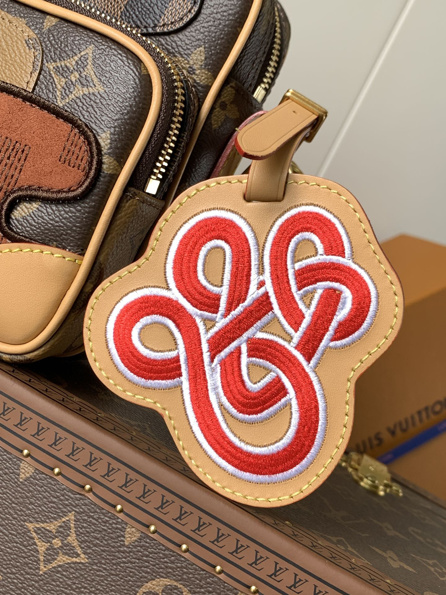 5 Louis Vuitton This Nil messenger bag features a Monogram canvas body accented with Damier and Monogram Reverse canvas patches, creating an elegant patchwork effect.