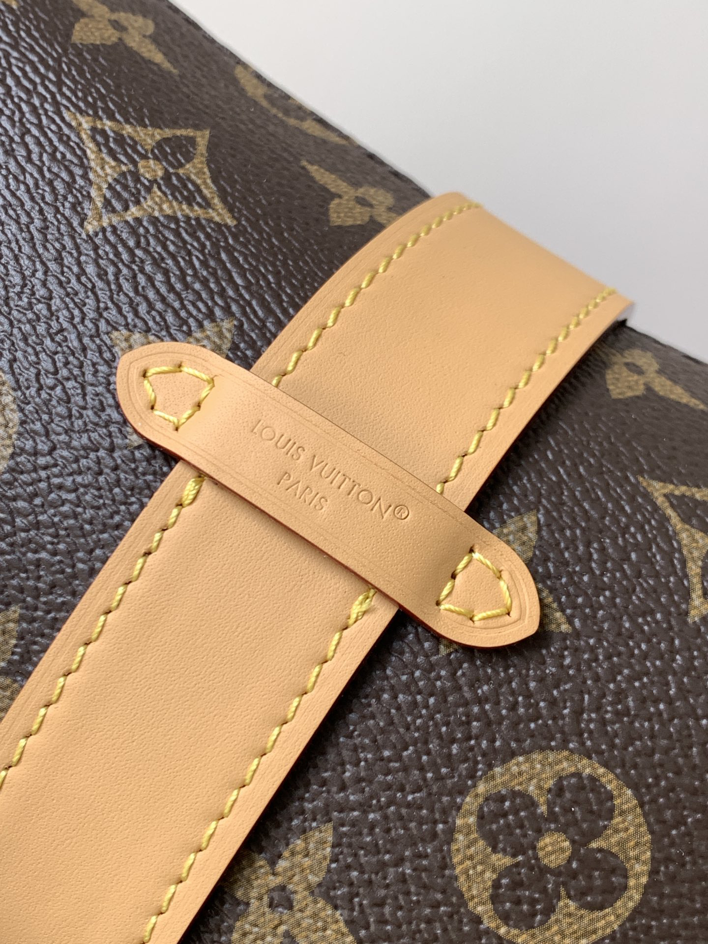 5 Louis Vuitton This Pochette Mia handbag, part of the Monogram collection, features a Monogram canvas body accented with cowhide leather trim.