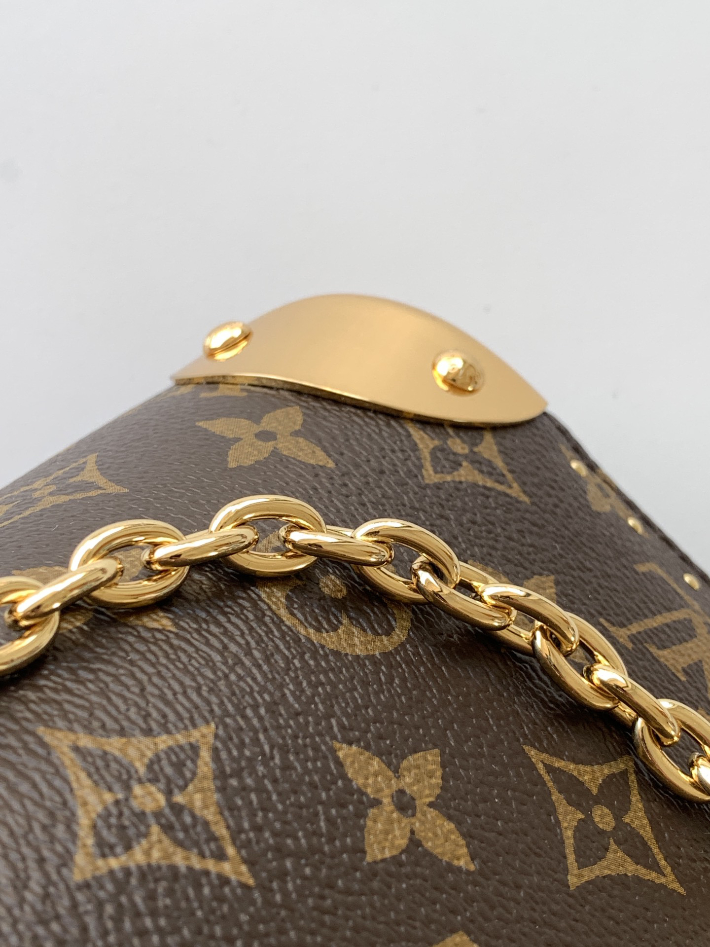 5 Louis Vuitton The Trunk collection welcomes a contemporary new iteration of the Alma Small handbag, paying homage to the brand's travel heritage with exquisite metal hardware.