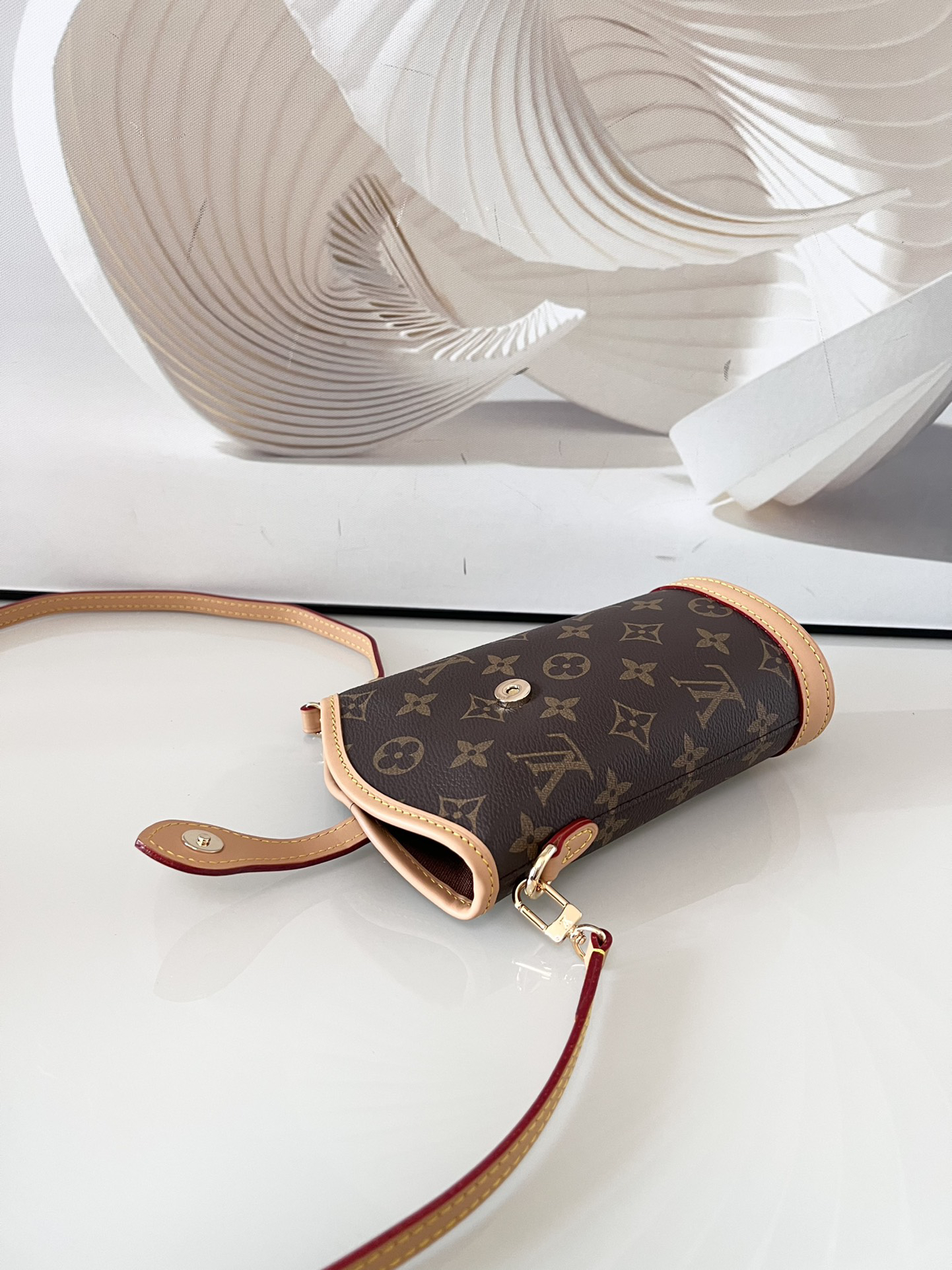 5 Louis Vuitton Mini Ice Cream Cone Bag — New "Fold Me" Mini Model, featuring a magnetic button closure design.