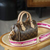 Louis Vuitton The Speedy Bandoulière 20 carries the DNA of a century-old heritage, featuring an iconic, three-dimensional "pillow" silhouette that is both sleek and structured.