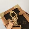 Louis Vuitton This large Side Trunk handbag features Monogram canvas accented with contrasting leather trim.