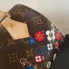 Louis Vuitton This Speedy Bandoulière 20 handbag combines Monogram canvas with cowhide leather trim.