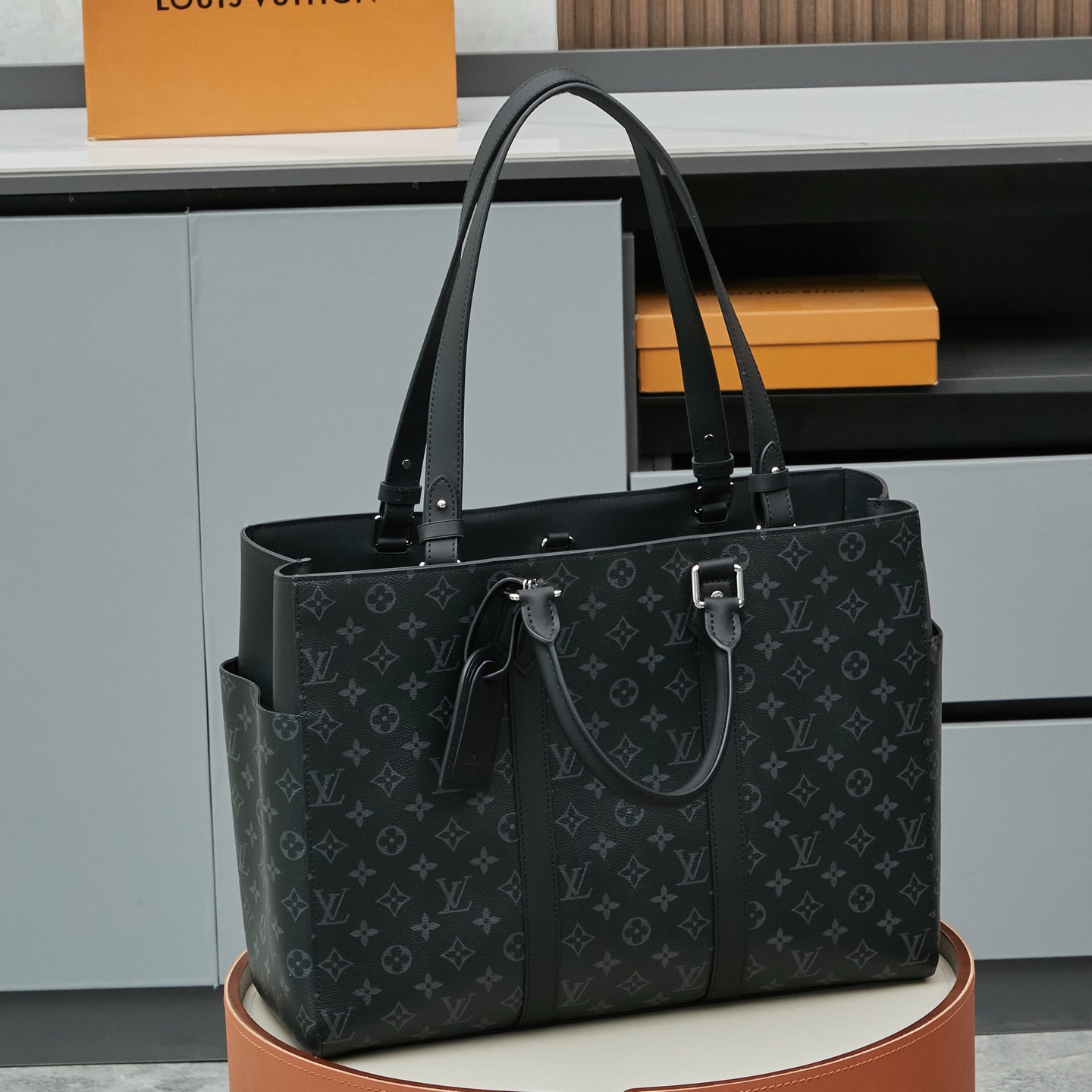 5 Louis Vuitton M46451 Black Monogram: A spacious handbag from the Sac Plat collection, the Sac Plat 24H features leather trim.