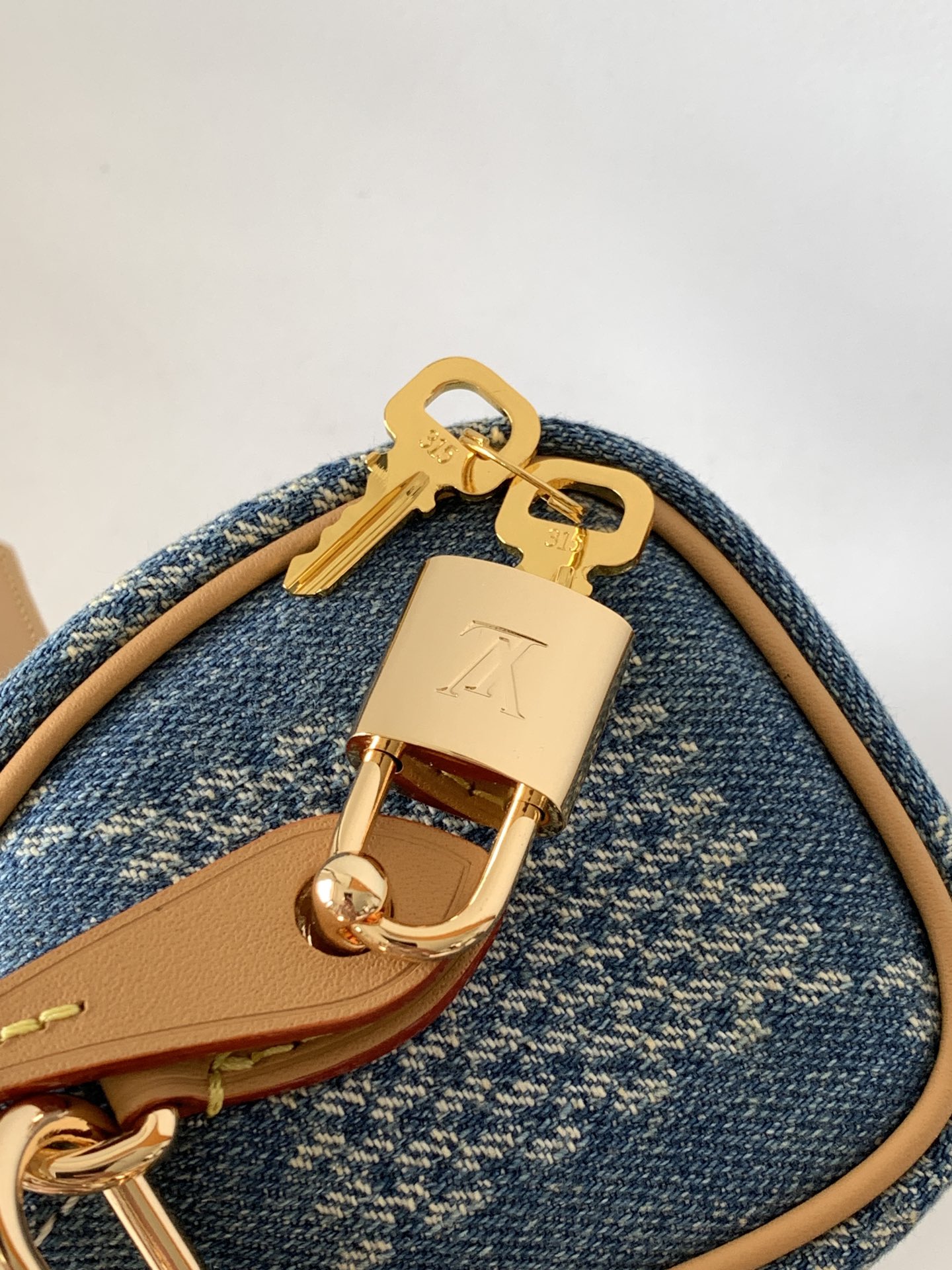 5 Louis Vuitton N40682 — FW New Denim Collection. The Sunset bag takes center stage in Monogram Denim canvas.