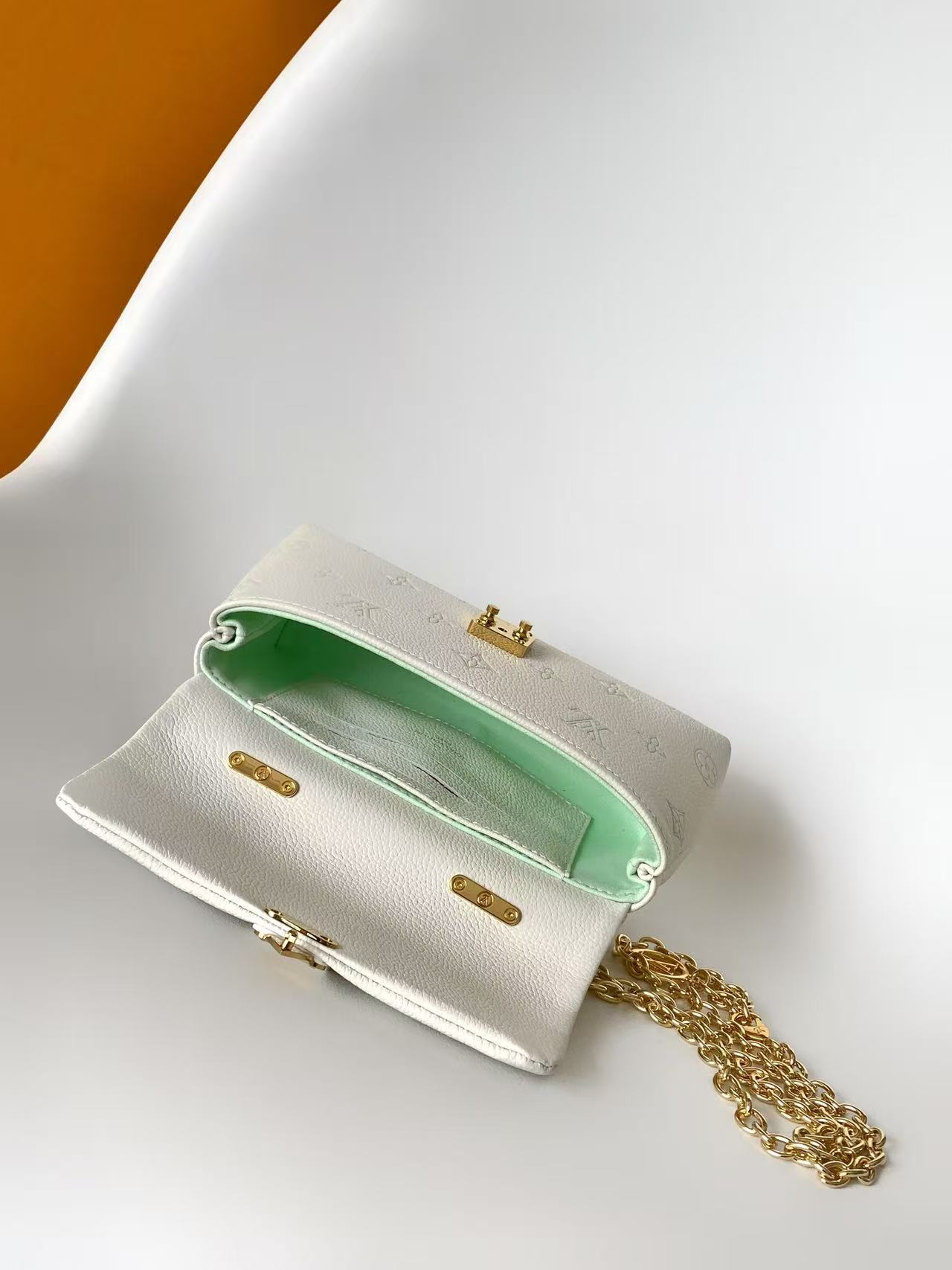 Louis Vuitton This Nano Madeleine handbag reimagines the Madeleine in Monogram Empreinte leather.