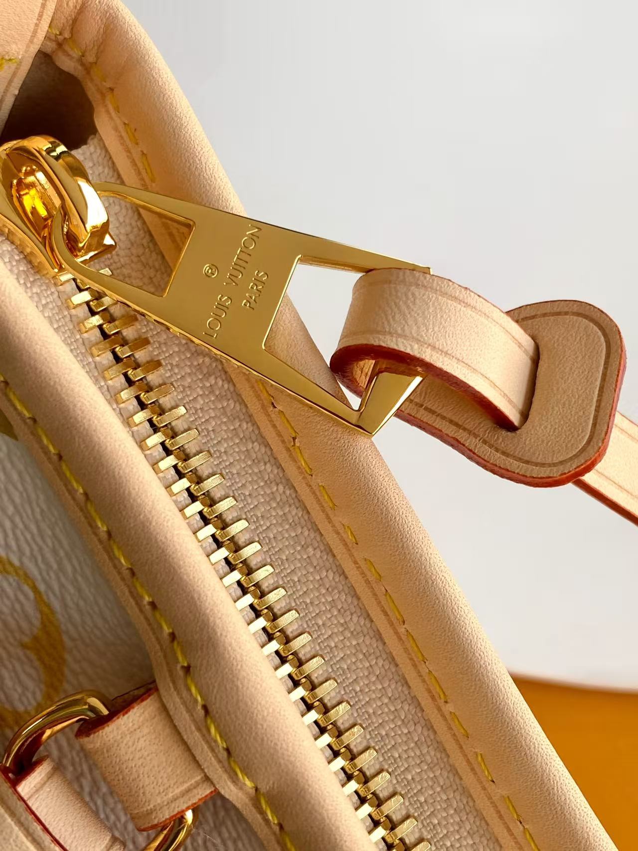 6 Louis Vuitton This Carryall East-West canvas handbag illuminates this classic element with a vibrant splash of color.