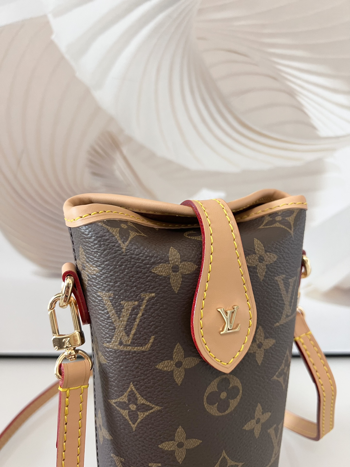 6 Louis Vuitton Mini Ice Cream Cone Bag — New "Fold Me" Mini Model, featuring a magnetic button closure design.