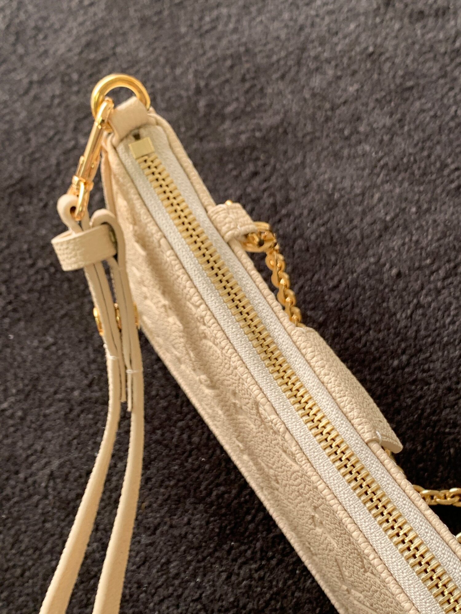6 Louis Vuitton The Easy Pouch On Strap handbag from the Spring 2022 Collection is crafted from Monogram Empreinte leather.