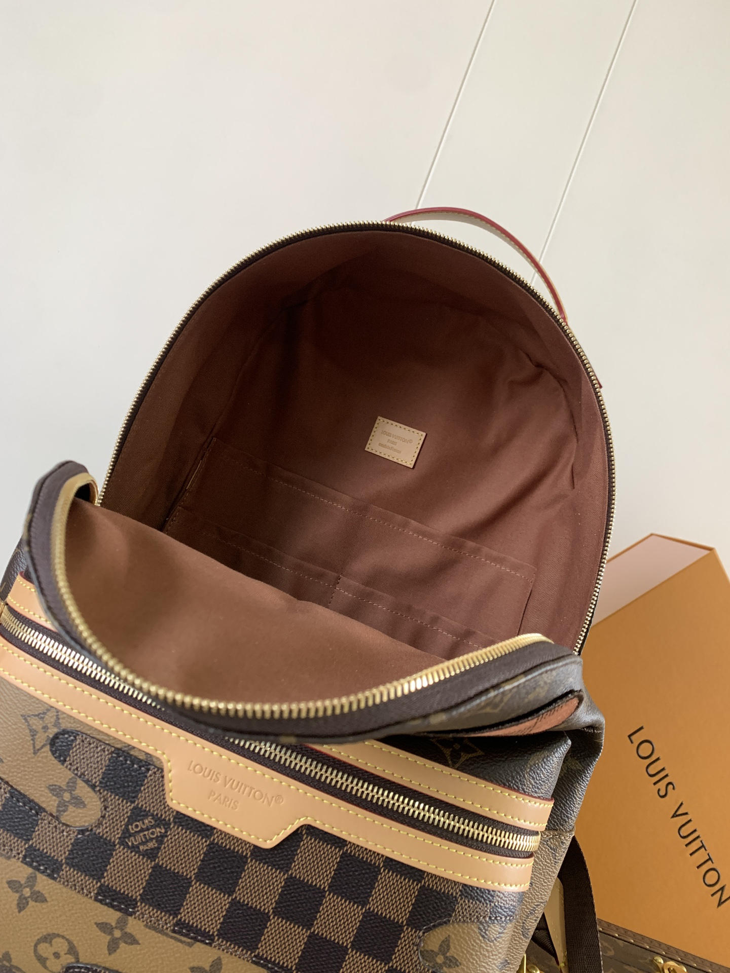 7 Louis Vuitton This Discovery Small Backpack features Monogram canvas accented with Monogram Reverse and Damier canvas patches.