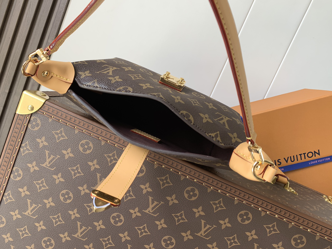 7 Louis Vuitton This Pochette Mia handbag, part of the Monogram collection, features a Monogram canvas body accented with cowhide leather trim.