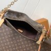 Louis Vuitton This large Side Trunk handbag features Monogram canvas accented with contrasting leather trim.