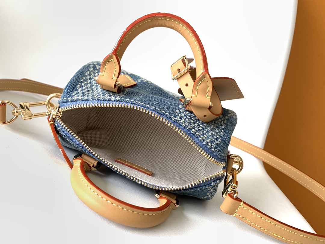 7 Louis Vuitton N40682 — FW New Denim Collection. The Sunset bag takes center stage in Monogram Denim canvas.