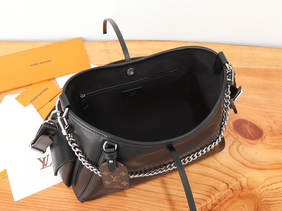 7 Louis Vuitton This small CarryAll Cargo handbag is crafted from soft lambskin, featuring a stylishly micro-crinkled finish.