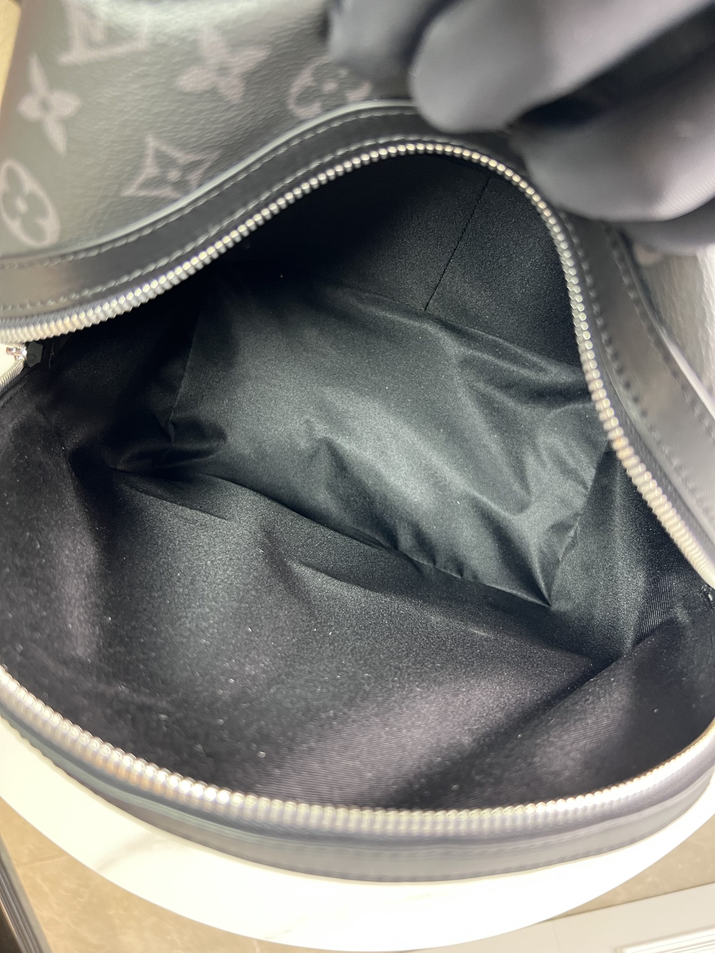 7 Crafted from Monogram Eclipse canvas, this small Discovery backpack retains its versatile functionality in a more compact silhouette.