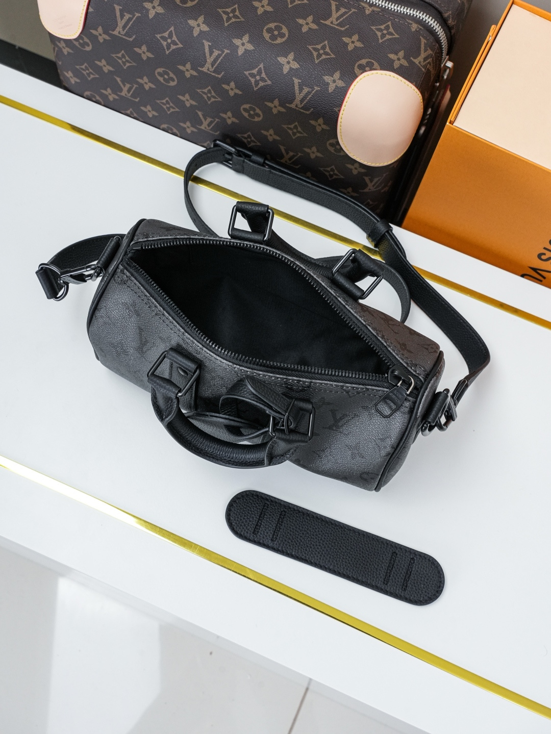 8 Louis Vuitton This Keell Bandoulière 25 handbag features Monogram Midnight coated canvas accented with a deep Monogram print.