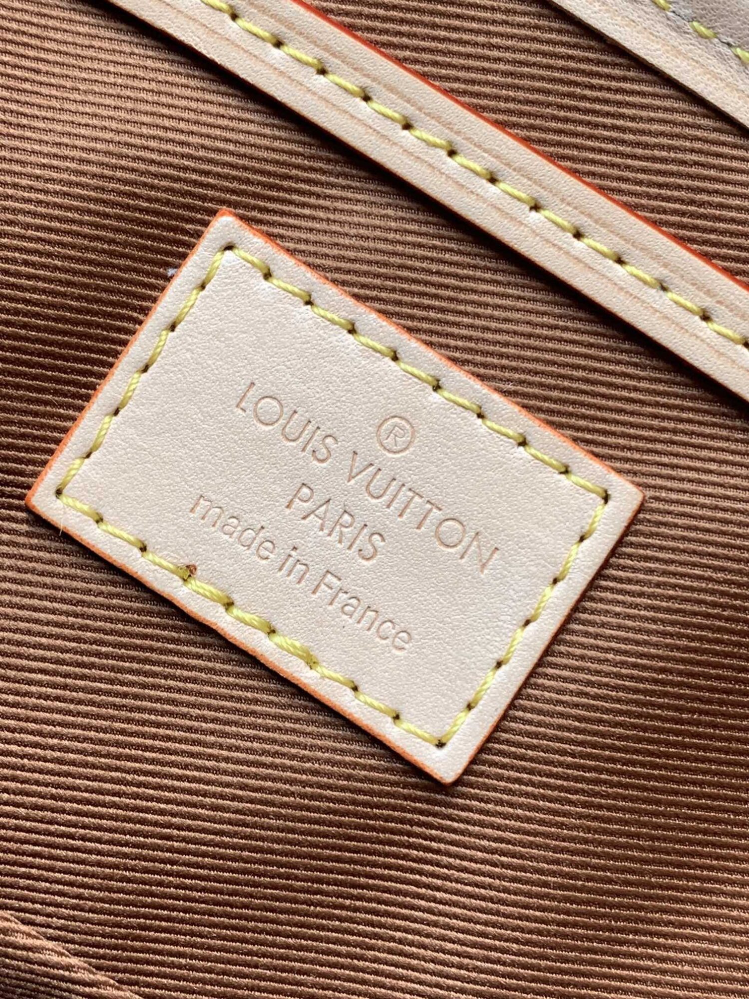 8 Louis Vuitton This Montsouris Mini features Monogram coated canvas with cowhide leather trim.