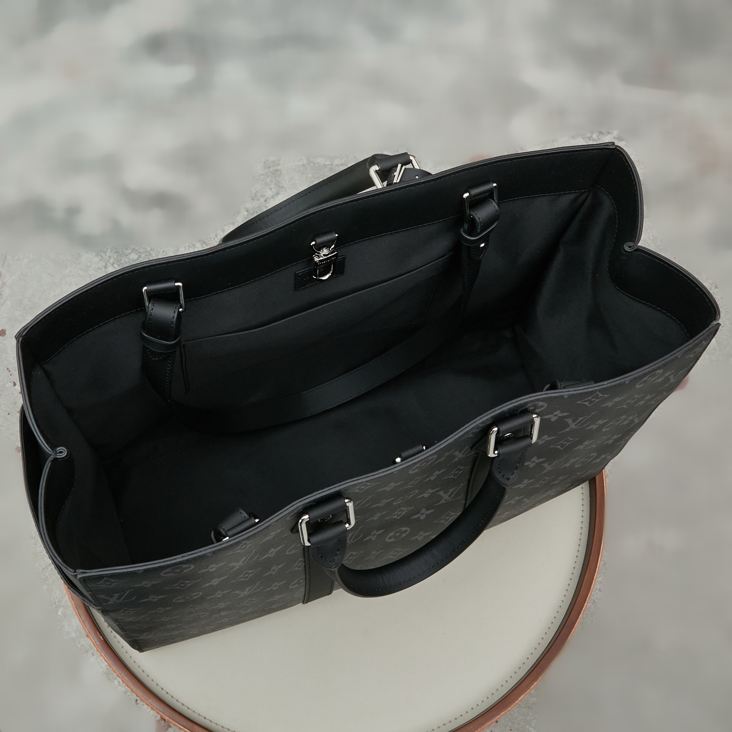 8 Louis Vuitton M46451 Black Monogram: A spacious handbag from the Sac Plat collection, the Sac Plat 24H features leather trim.