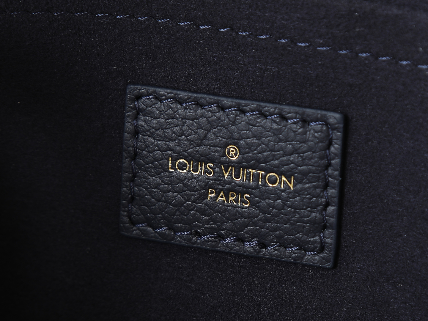 8 Louis Vuitton M23640 Deep Blue Embossed: This small OnTheGo handbag is crafted from Monogram Empreinte leather, embossed with the Giant Monogram pattern.
