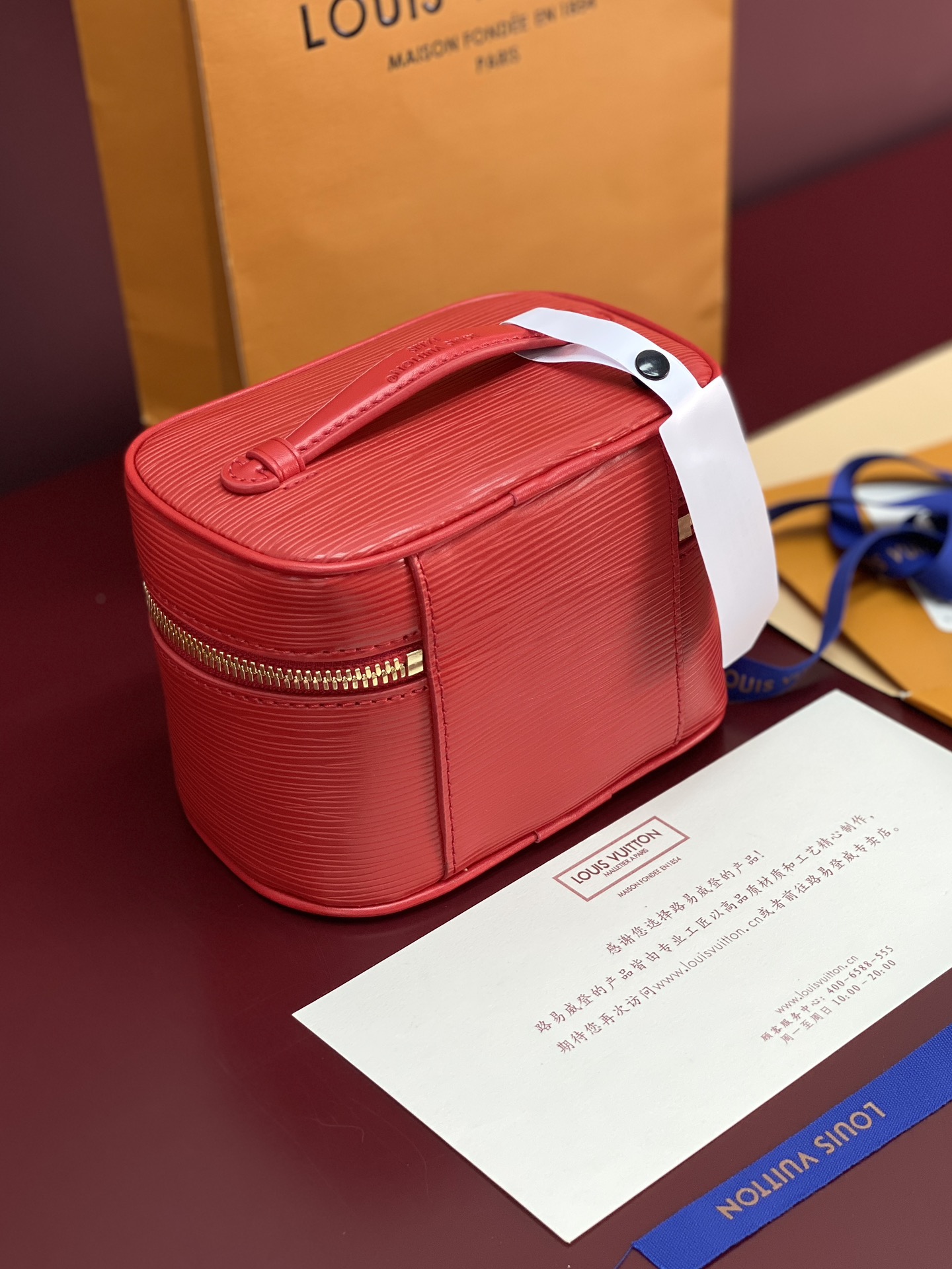 1 Louis Vuitton M25855 Red Small! New Season NICE NANO Bag with Grain Texture. This Nice Nano bag features a grained finish.