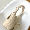 1 Louis Vuitton The Sac Sport handbag features a curved silhouette crafted from supple Monogram Empreinte embossed leather.