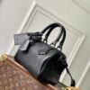 1 Louis Vuitton The M23807 black Speedy P9 Bandoulière 20 handbag is crafted from glossy calfskin leather.
