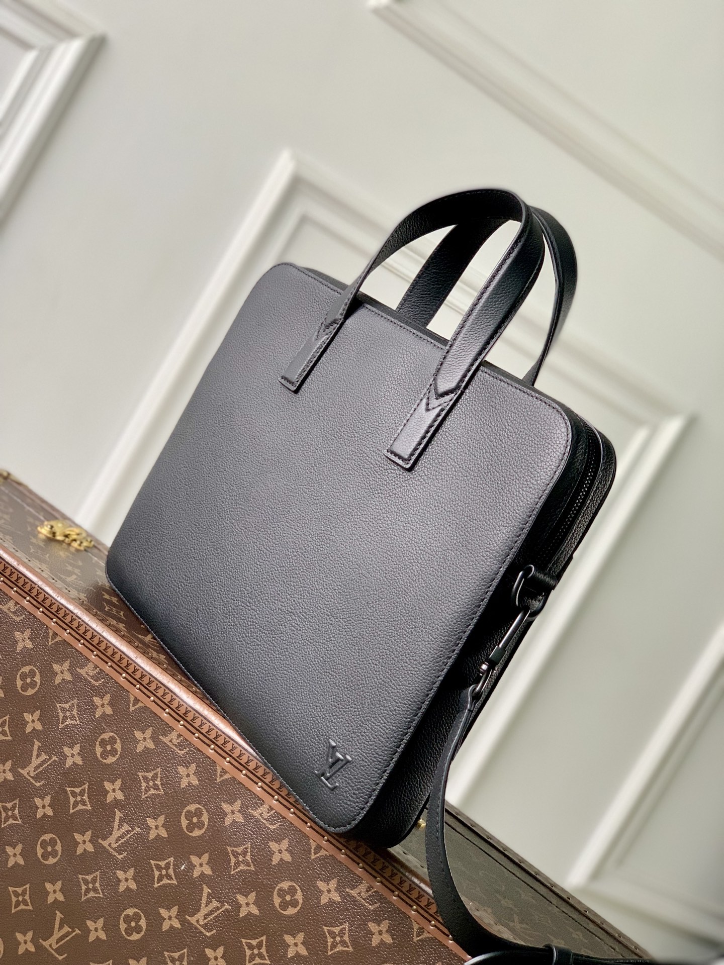 1 Louis Vuitton The M15258 Gate briefcase is crafted from waxed cowhide leather, featuring a supple design and ample space.