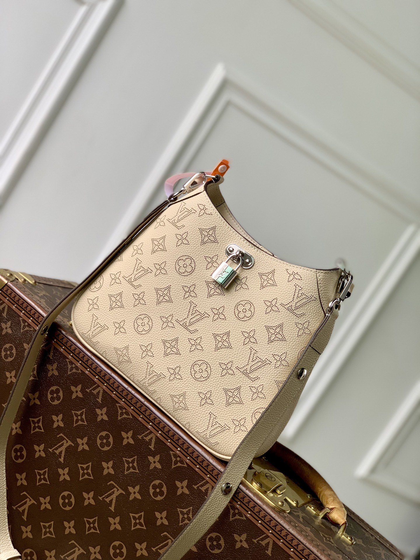 1 Louis Vuitton M27459 Off-white All Around small handbag from the Mahina series.