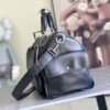 Louis Vuitton M13992 This Keepall Bandoulière 50 travel bag features a Monogram pattern on its canvas surface.