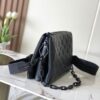 1 Louis Vuitton M11370 Black embossed leather bag with black chain.