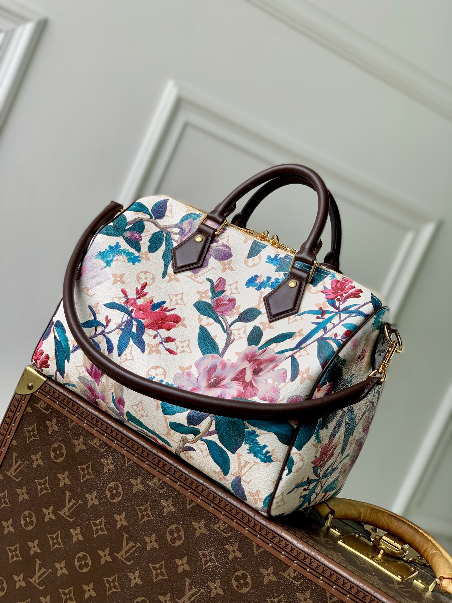 Louis Vuitton The M29066 floral Speedy 30 Soft handbag is from the Monogram Eden collection.