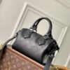 2 Louis Vuitton The M23807 black Speedy P9 Bandoulière 20 handbag is crafted from glossy calfskin leather.