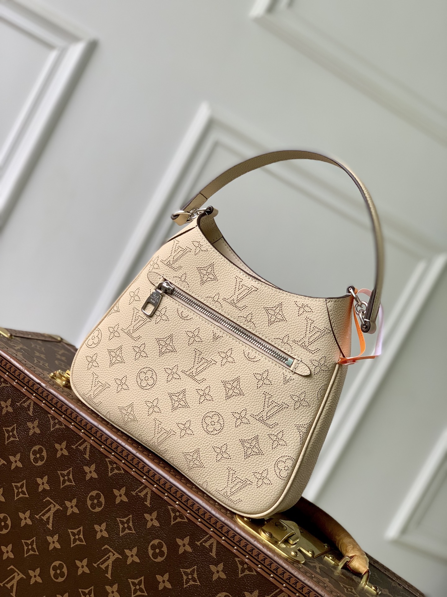 2 Louis Vuitton M27459 Off-white All Around small handbag from the Mahina series.